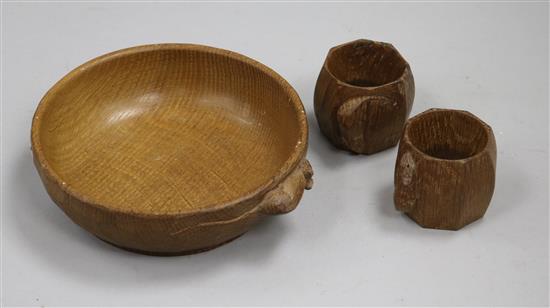A Robert Thompson (Mouseman) carved oak bowl and a pair of matching serviette rings (3)